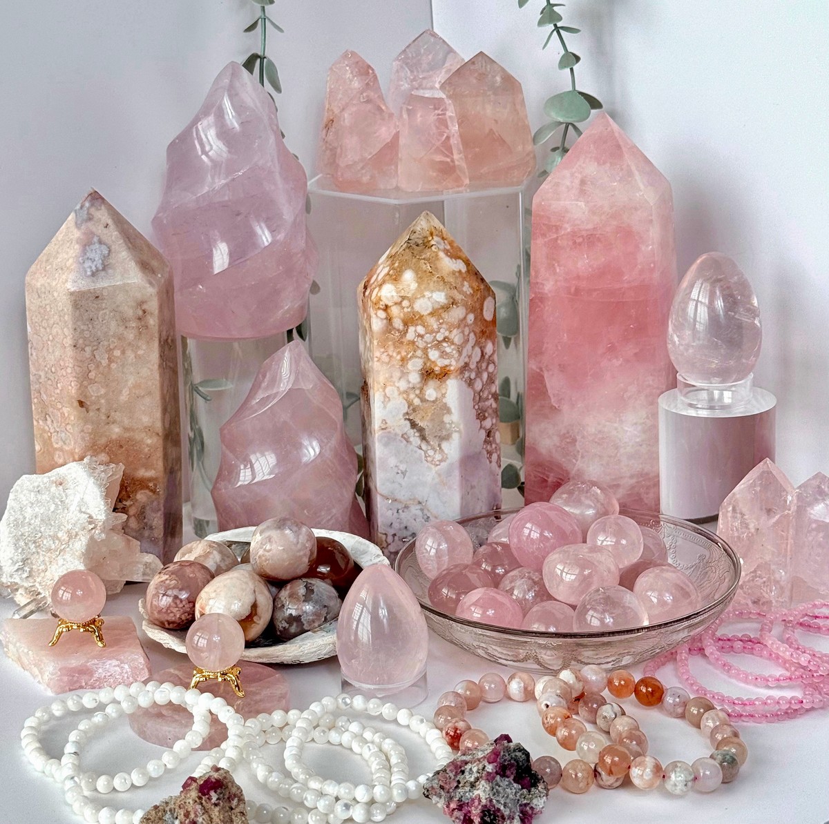 Rose quartz flames, towers, and tumbles. Flower agate and pink amethyst towers and tumbles. Garnet in matrix.